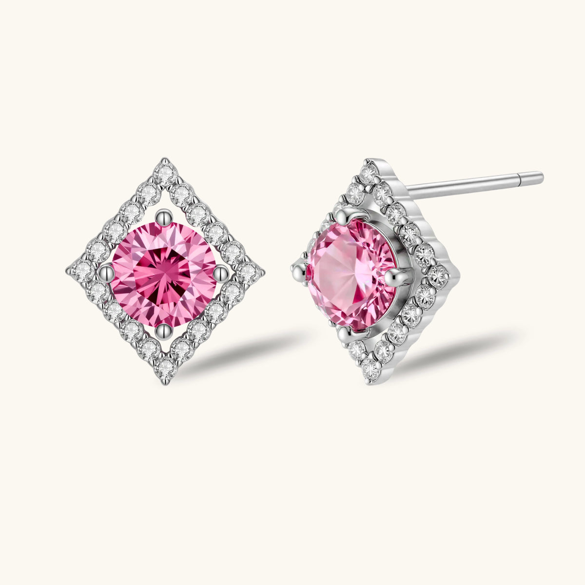 Sterling silver diamond-shaped stud earrings with pink moissanite center stones and crystal halo setting on white background