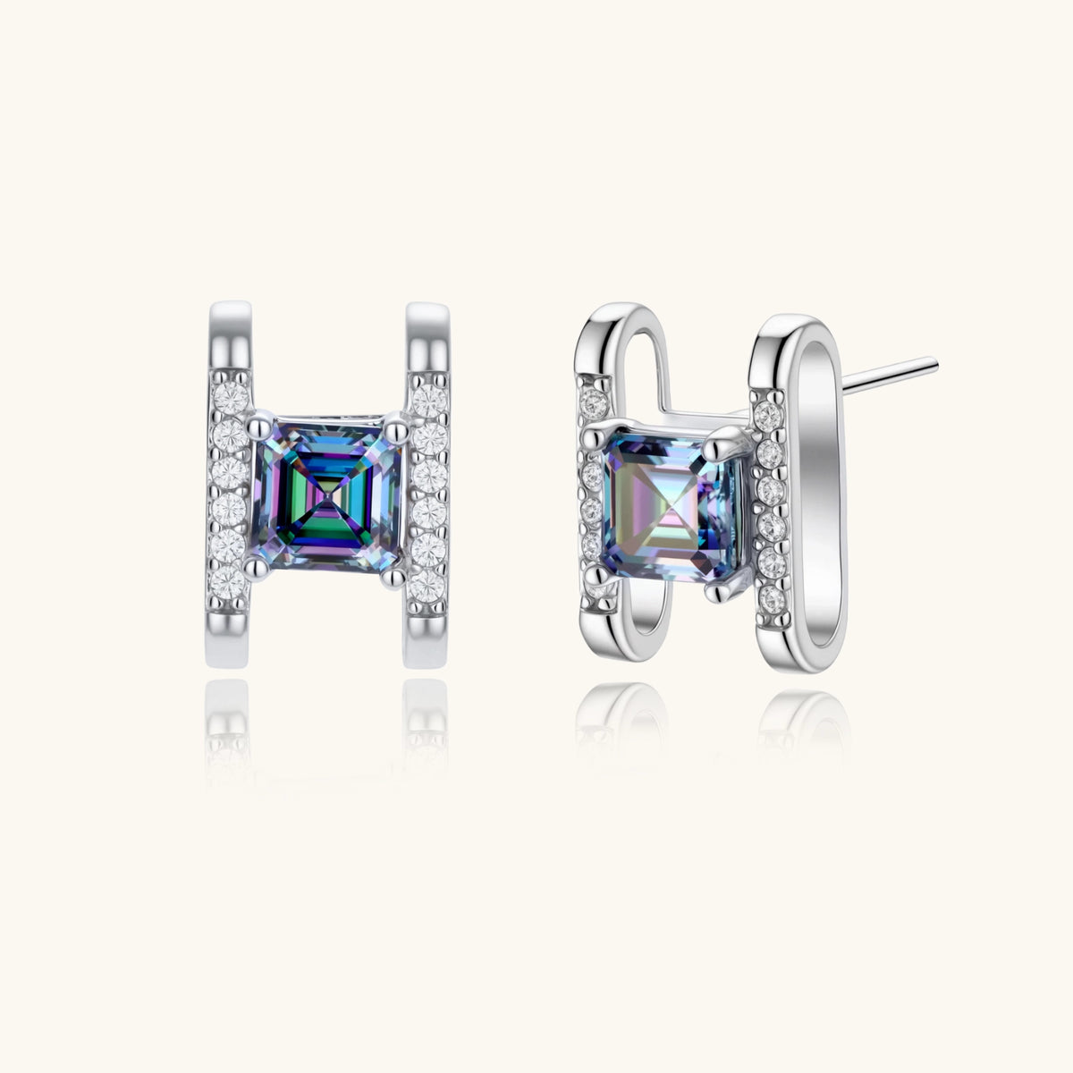 Square moissanite studs in sterling silver geometric setting showing rainbow prismatic fire on white background.