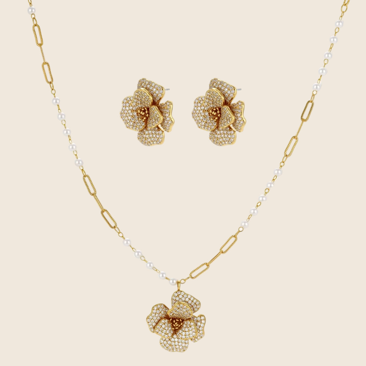 14K gold-plated flower jewelry set with zirconia crystals, featuring dimensional petal necklace and matching earrings