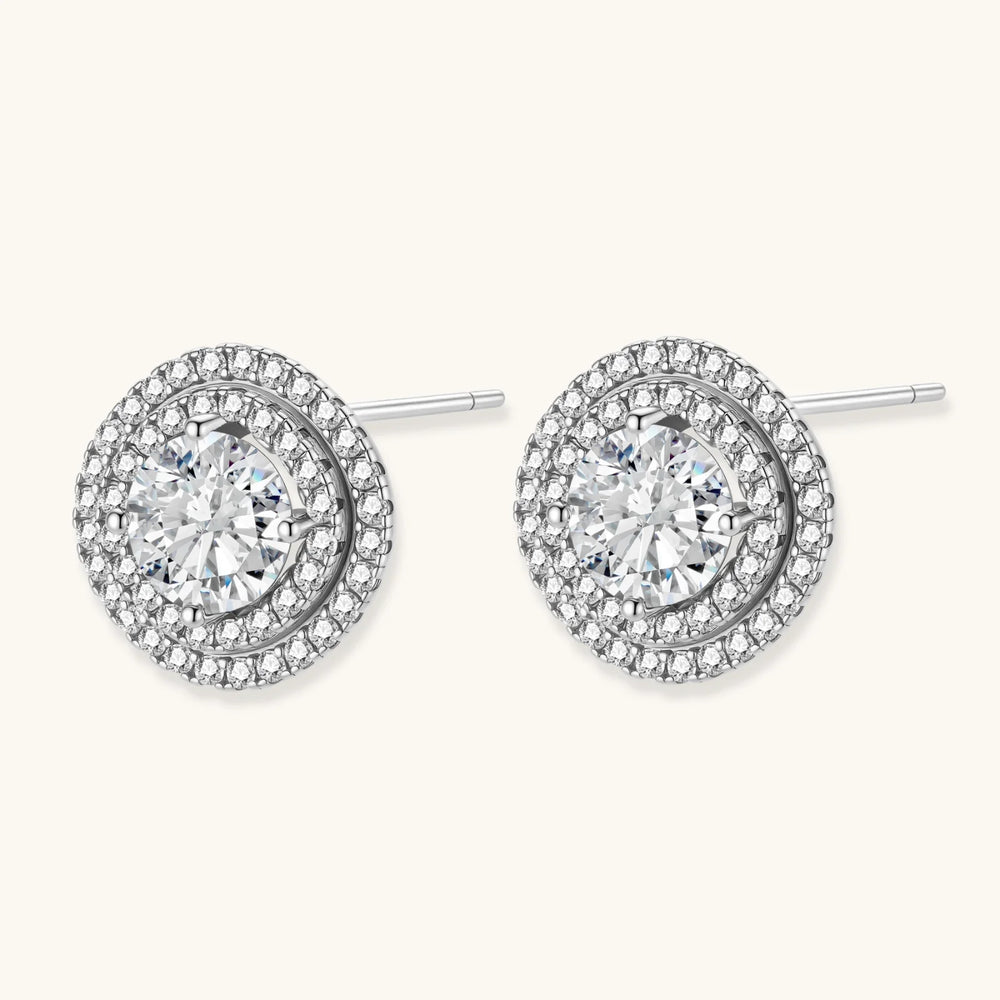 Double halo sterling silver stud earrings with brilliant round moissanite center stones and pavé crystal accents