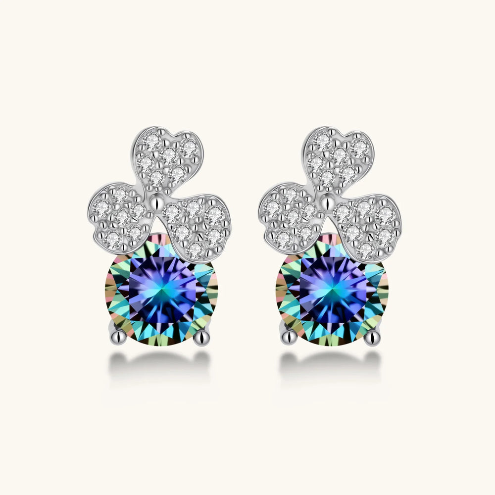 Sterling silver stud earrings with four-leaf clover design featuring small crystals above round moissanite stones