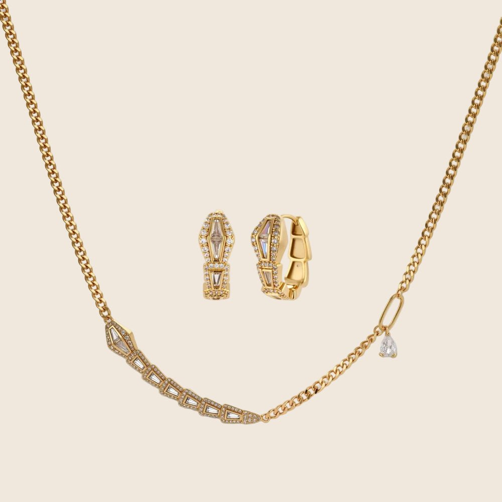 Gold-plated necklace with geometric diamond segments and matching huggie earrings featuring cubic zirconia details