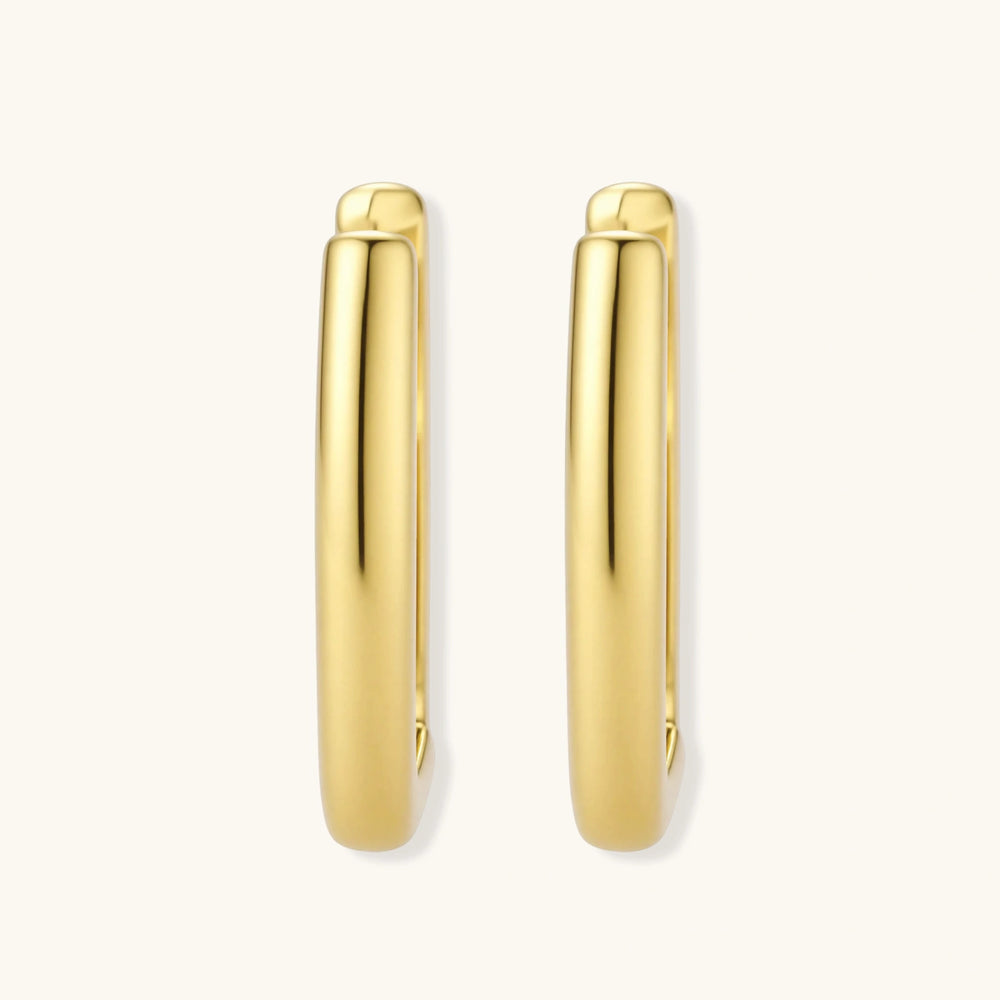 Polished gold-plated sterling silver hoop earrings with hinged closure mechanism on white background.